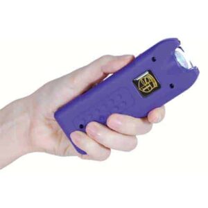 purple print multi guard stun gun in hand