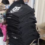 stack of knights armory shirts